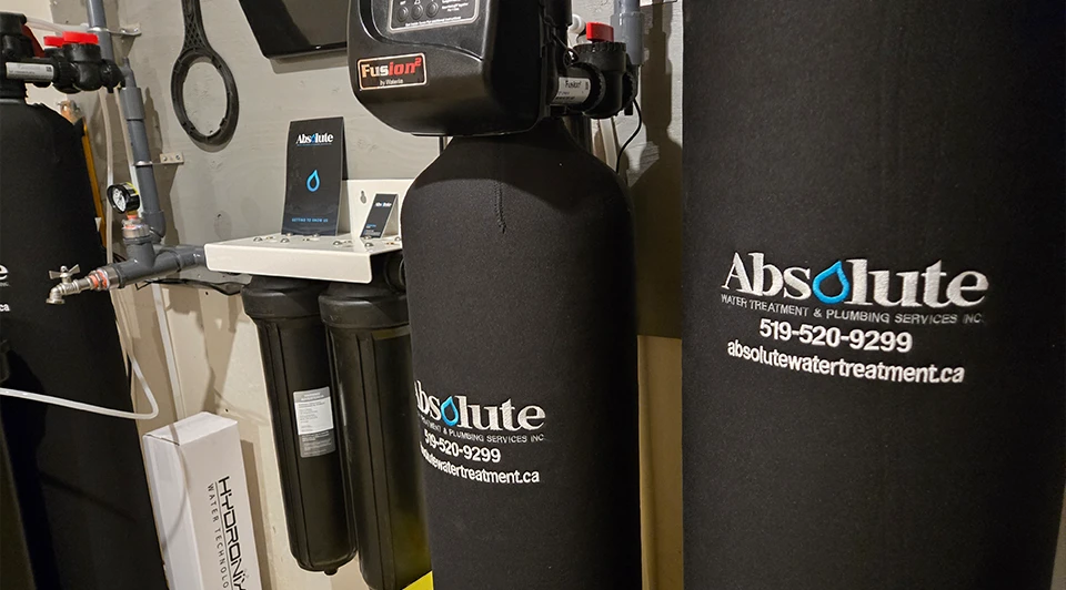 Compact Deluxe side-by-side water filter and softener unit installed in a Port Stanley Ontario residence